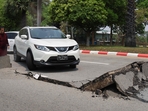A car attempts to drive along a damaged road in Naypyidaw on March 28, 2025, after an earthquake in central Myanmar. (AFP) A car attempts to drive along a damaged road in Naypyidaw on March 28, 2025, after an earthquake in central Myanmar. (AFP)