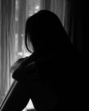 black and white of sad woman hug her knee and cry. Sad woman sitting alone in a empty room beside window or door (Siam - stock.adobe.com) black and white of sad woman hug her knee and cry. Sad woman sitting alone in a empty room beside window or door (Siam - stock.adobe.com)