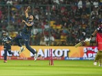 Mohammed Siraj took three wickets and conceded 19 runs and celebrated every scalp with his trademark vigour as he gave RCB a reminder of what they let go of before this season. His performance, along with a scintillating knock by Jos Buttler helped Gujarat Titans thrash the Royal Challengers Bengaluru by eight wickets in the latter's first home game of the season. (PTI) Mohammed Siraj took three wickets and conceded 19 runs and celebrated every scalp with his trademark vigour as he gave RCB a reminder of what they let go of before this season. His performance, along with a scintillating knock by Jos Buttler helped Gujarat Titans thrash the Royal Challengers Bengaluru by eight wickets in the latter's first home game of the season. (PTI)