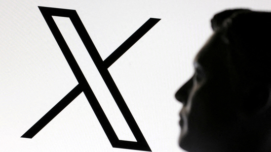 A 3D-printed miniature model of Elon Musk and the X logo are seen in this illustration taken January 23, 2025.(Reuters)