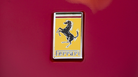 Ferrari has leased a 10,000 sq ft showroom space in North Bengaluru, near Kempegowda International Airport, at a monthly rent of <span class='webrupee'>₹</span>8 lakh. (In photo: A Ferrari logo is seen on a Ferrari outside the New York Stock Exchange) (Representational photo)(Reuters)