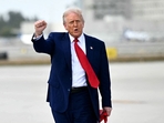 US President Donald Trump pumps his fist upon arrival at Miami International Airport.(AFP) US President Donald Trump pumps his fist upon arrival at Miami International Airport.(AFP)