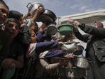 Palestinians wait to get donated food at a distribution center in Beit Lahiya in the northern Gaza Strip, Monday, April 7, 2025. (AP) Palestinians wait to get donated food at a distribution center in Beit Lahiya in the northern Gaza Strip, Monday, April 7, 2025. (AP)