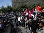 Pro-monarchy demonstrators scuffle with Nepal police during a protest to demand a Hindu state, in Kathmandu(AFP) Pro-monarchy demonstrators scuffle with Nepal police during a protest to demand a Hindu state, in Kathmandu(AFP)