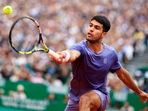 Spain's Carlos Alcaraz plays a backhand return(AFP) Spain's Carlos Alcaraz plays a backhand return(AFP)