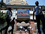Pedestrians walk past the Bombay Stock Exchange (BSE) building in Mumbai on April 7, 2025.(AFP) Pedestrians walk past the Bombay Stock Exchange (BSE) building in Mumbai on April 7, 2025.(AFP)