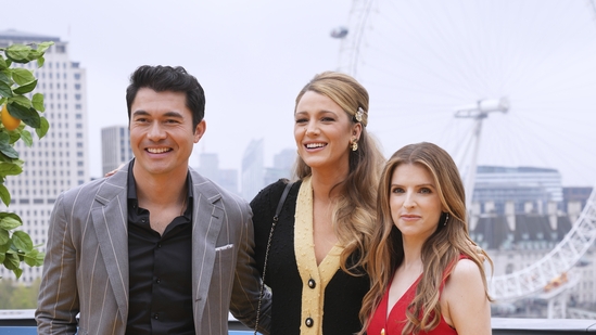 Henry Golding, from left,, Blake Lively and Anna Kendrick pose for photographers.(AP)