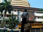 A pedestrian watches a digital screen on the facade of the Bombay Stock Exchange (BSE) in Mumbai.(Punit Paranjpe/AFP) A pedestrian watches a digital screen on the facade of the Bombay Stock Exchange (BSE) in Mumbai.(Punit Paranjpe/AFP)