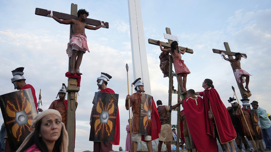 Venezuela: On Good Friday, April 18, 2025, penitents were depicted hanging on crosses in a powerful reenactment of the Way of the Cross during Holy Week celebrations in the Petare neighbourhood of Caracas, Venezuela. The solemn scene served as a vivid representation of Christ’s suffering.(AP Photo/Ariana Cubillos)