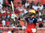 Devdutt Padikkal celebrates a fine half-century on return, his first in 22 IPL innings, as he tries to nail a spot down for RCB.(REUTERS)