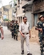 Security personnel keep vigil in Murshidabad on Sunday. (PTI) Security personnel keep vigil in Murshidabad on Sunday. (PTI)