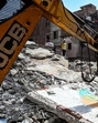 On Sunday, survivors and residents of the building were seen gravitating towards the site to either scour for belongings or in disbelief over the death of their loved ones. (Salman Ali/HT Photo) On Sunday, survivors and residents of the building were seen gravitating towards the site to either scour for belongings or in disbelief over the death of their loved ones. (Salman Ali/HT Photo)