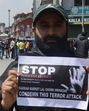 A Kashmiri trader holds a sign during a protest in Srinagar on Wednesday, a day after the terror attack on tourists in south Kashmir’s Pahalgam. (Reuters photo) A Kashmiri trader holds a sign during a protest in Srinagar on Wednesday, a day after the terror attack on tourists in south Kashmir’s Pahalgam. (Reuters photo)