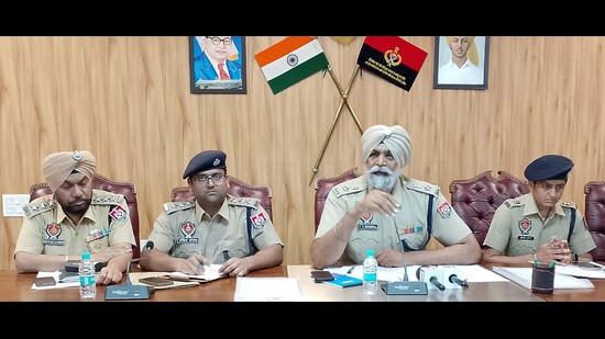 DCP law and order Parminder Singh Bhandal and other officials addressing a press conference on Wednesday. (HT Photo)