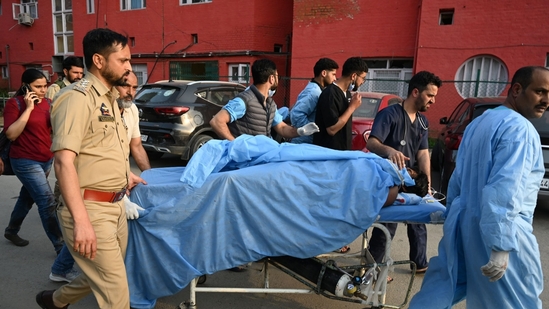 Paramedics carry an injured tourist at a hospital in Anantnag south of Srinagar, on April 22.(Waseem Andrabi /Hindustan Times) Paramedics carry an injured tourist at a hospital in Anantnag south of Srinagar, on April 22.(Waseem Andrabi /Hindustan Times)