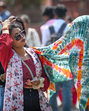 Visitors at the Red Fort cover their heads to shield themselves from the midday sun. (Sanchit Khanna/HT Photo) Visitors at the Red Fort cover their heads to shield themselves from the midday sun. (Sanchit Khanna/HT Photo)