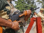 Kathua: A BSF jawan guards as Jammu and Kashmir Police personnel check the vehicles on the Jammu-Srinagar highway after a truck was seized with arms and ammunition, in Kathua, Jammu, Thursday, Sept 12, 2019. (PTI) Kathua: A BSF jawan guards as Jammu and Kashmir Police personnel check the vehicles on the Jammu-Srinagar highway after a truck was seized with arms and ammunition, in Kathua, Jammu, Thursday, Sept 12, 2019. (PTI)