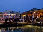 Sip on a handcrafted cocktail at Barfussbar while enjoying stunning views of Zurich’s Old Town. Sip on a handcrafted cocktail at Barfussbar while enjoying stunning views of Zurich’s Old Town.