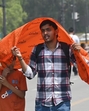 Visitors to Kartavya Path cover their heads while walking to shield themselves from the sun. (Sanjeev Verma/HT Photo) Visitors to Kartavya Path cover their heads while walking to shield themselves from the sun. (Sanjeev Verma/HT Photo)