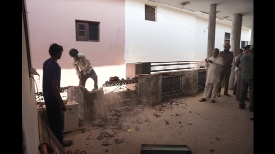 A demolition work in progress in a building in Jalandhar’s Lakhanpal village on Sunday.