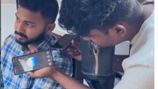 A young Bengaluru man uses AI to fix an auto price in Bengaluru. A young Bengaluru man uses AI to fix an auto price in Bengaluru.