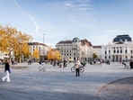 Locals soak in the sun and fall colors at Zurich’s vibrant central square. Locals soak in the sun and fall colors at Zurich’s vibrant central square.