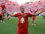 Liverpool's Trent Alexander-Arnold celebrates after winning the Premier League.