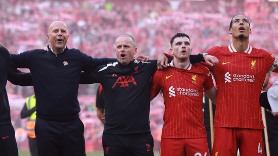 Liverpool manager Arne Slot, Andrew Robertson and Virgil van Dijk celebrate after winning the Premier League.(REUTERS)