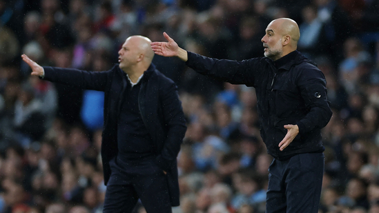 Liverpool manager Arne Slot and Manchester City manager Pep Guardiola during a match.(Action Images via Reuters)