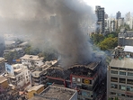 Thick plumes of smoke were seen spreading throughout the small area as firefighters used three small hose lines to control the fire.(Satish Bate/HT) Thick plumes of smoke were seen spreading throughout the small area as firefighters used three small hose lines to control the fire.(Satish Bate/HT)