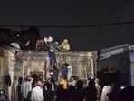 Firefighters evacuate people after a fire broke out at a hotel at Mechua in Kolkata on Tuesday.(PTI) Firefighters evacuate people after a fire broke out at a hotel at Mechua in Kolkata on Tuesday.(PTI)