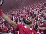 Liverpool's Mohamed Salah celebrates by taking a selfie after winning the English Premier League soccer match between Liverpool and Tottenham Hotspur and clinching the Premier League title at Anfield in Liverpool, England, Sunday, April 27, 2025. (Jon Super/AP) Liverpool's Mohamed Salah celebrates by taking a selfie after winning the English Premier League soccer match between Liverpool and Tottenham Hotspur and clinching the Premier League title at Anfield in Liverpool, England, Sunday, April 27, 2025. (Jon Super/AP)