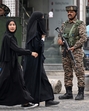 Indian paramilitary personnel stand guard as schoolgirls walk along a street in Srinagar on Thursday. (AFP) Indian paramilitary personnel stand guard as schoolgirls walk along a street in Srinagar on Thursday. (AFP)