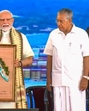 Modi started the visit with reviewing the operations, specially the Mediterranean Shipping Company (MSC) mother ship docked at the port (PTI) Modi started the visit with reviewing the operations, specially the Mediterranean Shipping Company (MSC) mother ship docked at the port (PTI)