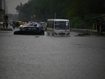 Commuters wade through a water logged stretch after rains at NH24 near Vinod Nagar (Raj K Raj/ Hindustan Times). Commuters wade through a water logged stretch after rains at NH24 near Vinod Nagar (Raj K Raj/ Hindustan Times).