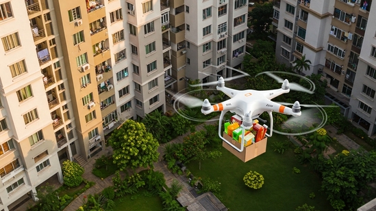 An apartment complex in South Bengaluru now receives groceries, medicines, and daily essentials through drone deliveries. (Representational Image)(AI-generated image created by Gemini ) An apartment complex in South Bengaluru now receives groceries, medicines, and daily essentials through drone deliveries. (Representational Image)(AI-generated image created by Gemini )