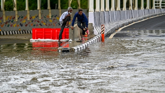NDMC workers try to open the choked drains and clear a waterlogged stretch after rain and storm outside the Bharat Mandapam underpass, Pragati Maidan, in New Delhi, India, on Friday, May 2, 2025. (Photo by RAJ K RAJ / Hindustan Times) NDMC workers try to open the choked drains and clear a waterlogged stretch after rain and storm outside the Bharat Mandapam underpass, Pragati Maidan, in New Delhi, India, on Friday, May 2, 2025. (Photo by RAJ K RAJ / Hindustan Times)