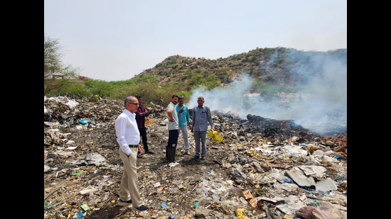 Administrative officials visit the spot where rampant burning of chemical waste occurs in Khori village near the Rajasthan border on Saturday. (Parveen Kumar/HT PHOTO) Administrative officials visit the spot where rampant burning of chemical waste occurs in Khori village near the Rajasthan border on Saturday. (Parveen Kumar/HT PHOTO)