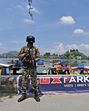 A soldier stands guard on the banks of the Dal Lake in Srinagar on Sunday. (Waseem Andrabi /HT) A soldier stands guard on the banks of the Dal Lake in Srinagar on Sunday. (Waseem Andrabi /HT)