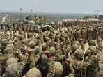 Pakistan's Army Chief Asim Munir, second left standing on tank, chant 'long live Pakistan' slogans with soldiers during his visit to witness military exercises, in Tilla Field Firing Range in the Jhelum district.(AP) Pakistan's Army Chief Asim Munir, second left standing on tank, chant 'long live Pakistan' slogans with soldiers during his visit to witness military exercises, in Tilla Field Firing Range in the Jhelum district.(AP)