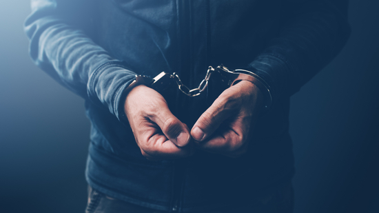 Arrested computer hacker and cyber criminal with handcuffs, close up of hands. (iStockphoto) Arrested computer hacker and cyber criminal with handcuffs, close up of hands. (iStockphoto)