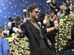 Shah Rukh Khan made his Met Gala debut, striking his signature pose on the blue carpet ahead of the opening of the Shah Rukh Khan made his Met Gala debut, striking his signature pose on the blue carpet ahead of the opening of the