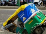 The autorickshaw plunged front-first into a sinkhole on Makarba Main Road, Ahmedabad. (X) The autorickshaw plunged front-first into a sinkhole on Makarba Main Road, Ahmedabad. (X)