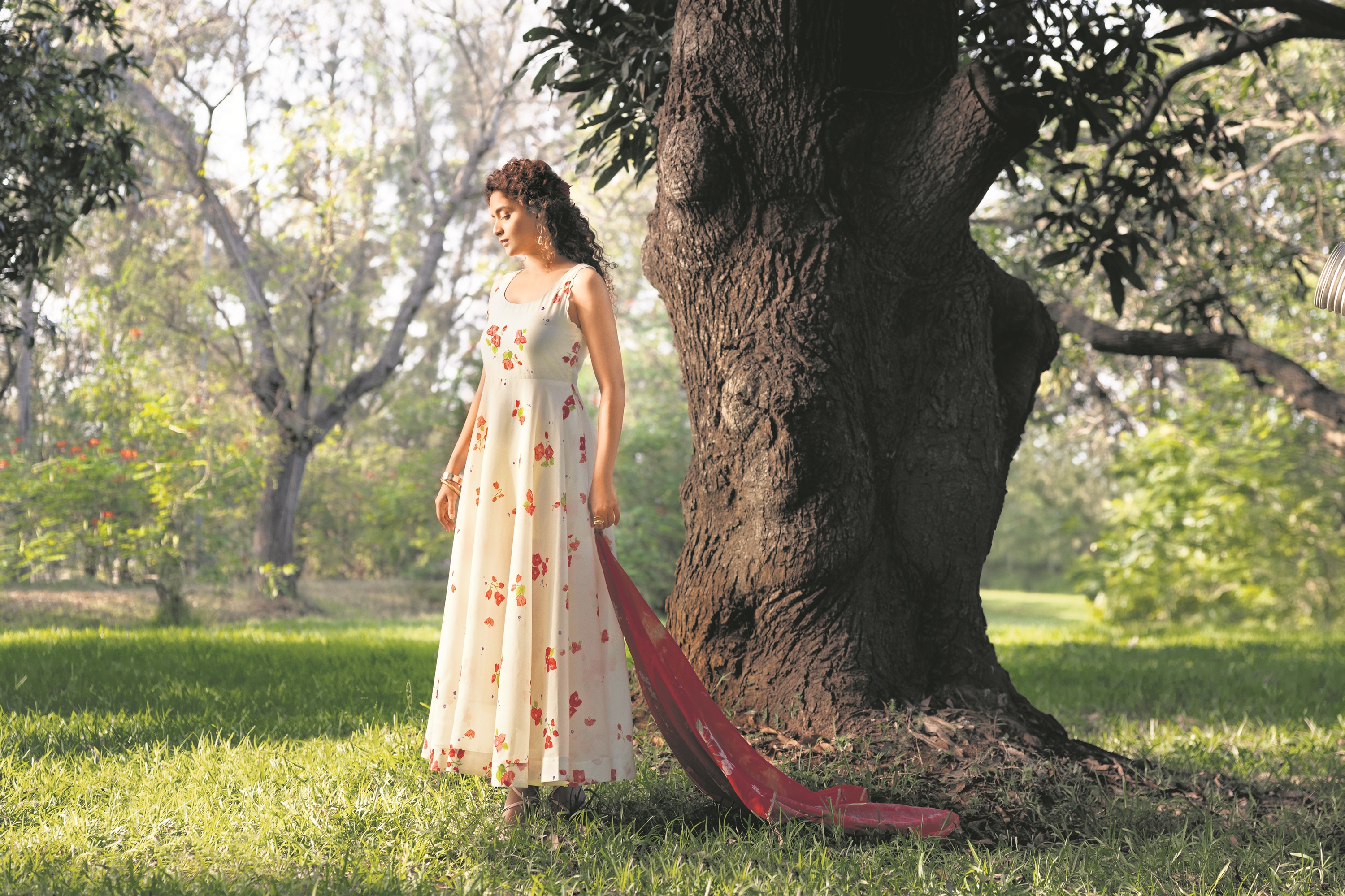 The actor embodies grace in an ecru circular kurta from W for Woman. The ensemble, featuring a bougainvillea print, is complemented with hoop earrings and two bangles. (Photographer: Sarang Gupta) The actor embodies grace in an ecru circular kurta from W for Woman. The ensemble, featuring a bougainvillea print, is complemented with hoop earrings and two bangles. (Photographer: Sarang Gupta)