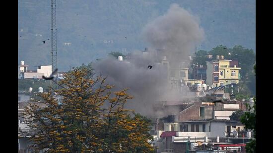 Smoke billows after an artillery shell landed in the main town of Poonch district in India's Jammu region on Wednesday. (AFP) Smoke billows after an artillery shell landed in the main town of Poonch district in India's Jammu region on Wednesday. (AFP)