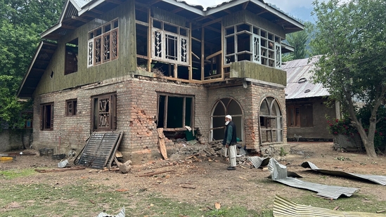 A man stands near damaged houses after shelling by Pakistani troops in Jammu and Kashmir's Uri. A man stands near damaged houses after shelling by Pakistani troops in Jammu and Kashmir's Uri.